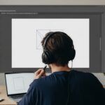 Designer creating clipping path in Adobe Illustrator workspace