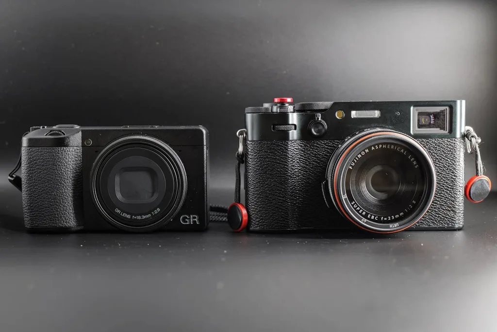Fujifilm X100VI next to compact Ricoh GR travel camera size comparison